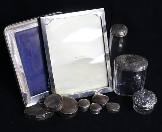 A group of silver including seven boxes, three jars and two photograph frames.